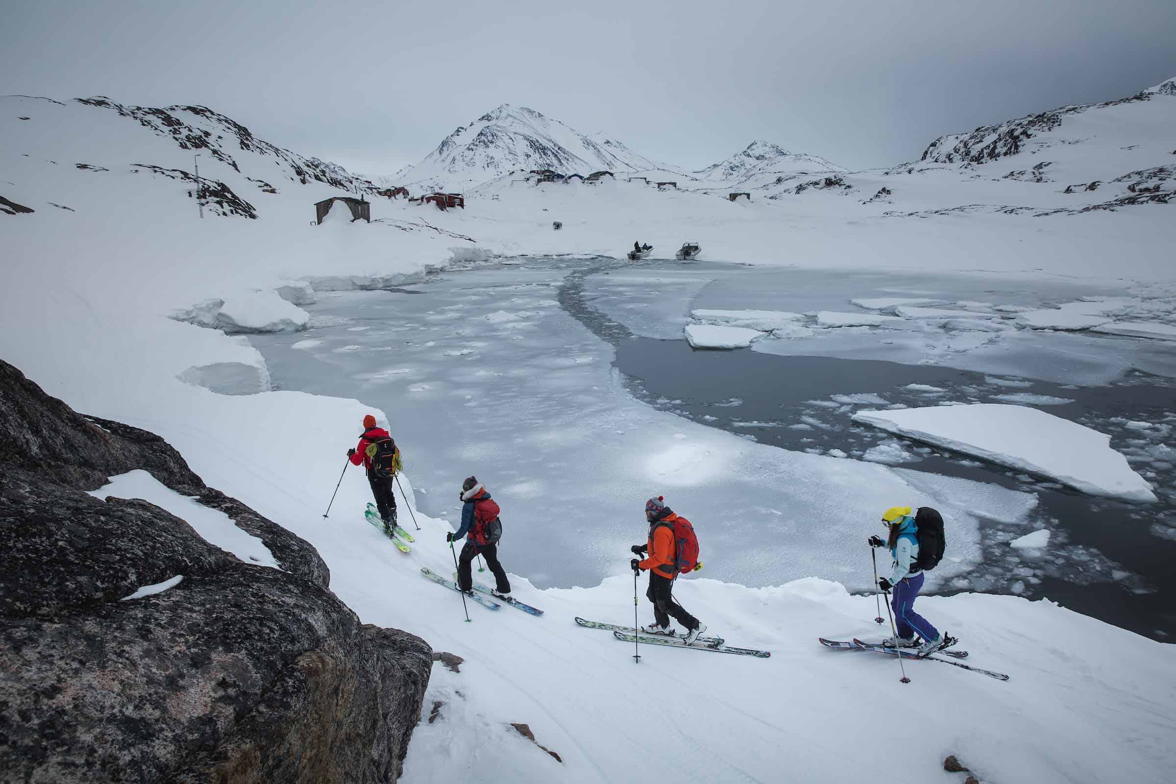 Skiers walking from the ice edge to Kulusuk in East Greenland. Photo by Mads Pihl - Visit Greenland