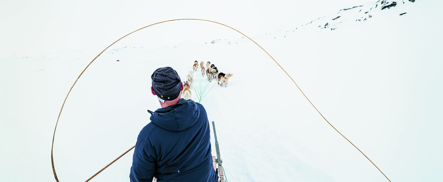 Dog sledding in the backcountry of East Greenland - Photo by Carsten Egevang - Visit East Greenland