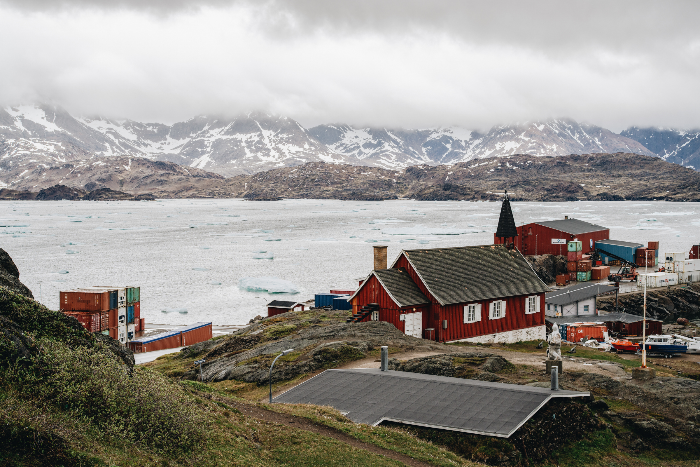View towards the museum and harbour in Tasiilaq. Photo by Filip Gielda - Visit East Greenland
