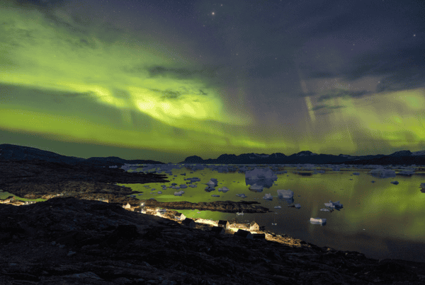 Magnificent northern lights over Tiilerilaaq. Photo by Anna & Lucas Jahn - Visit East Greenland