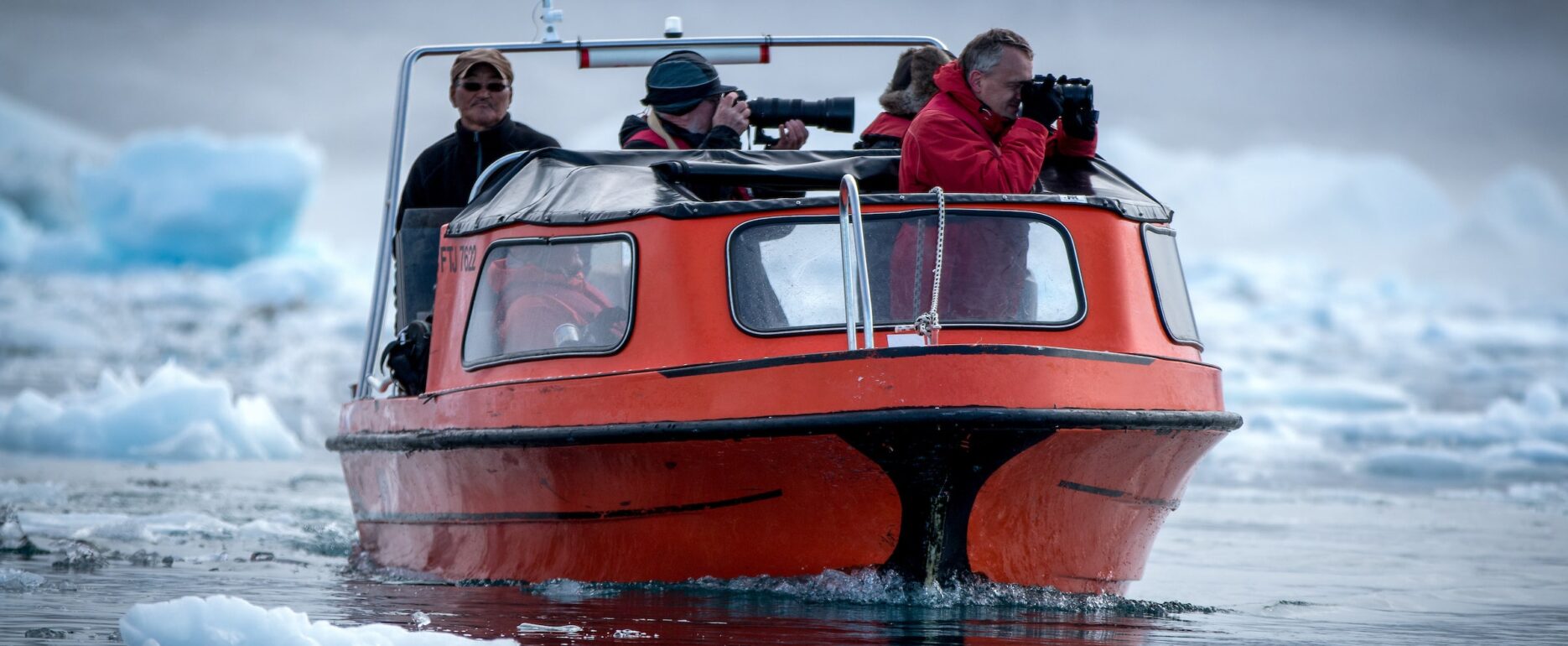 Photographers on a photo tour in Sermilik Icefjord in East Greenland. Photo by Mads Pihl - Visit Greenland