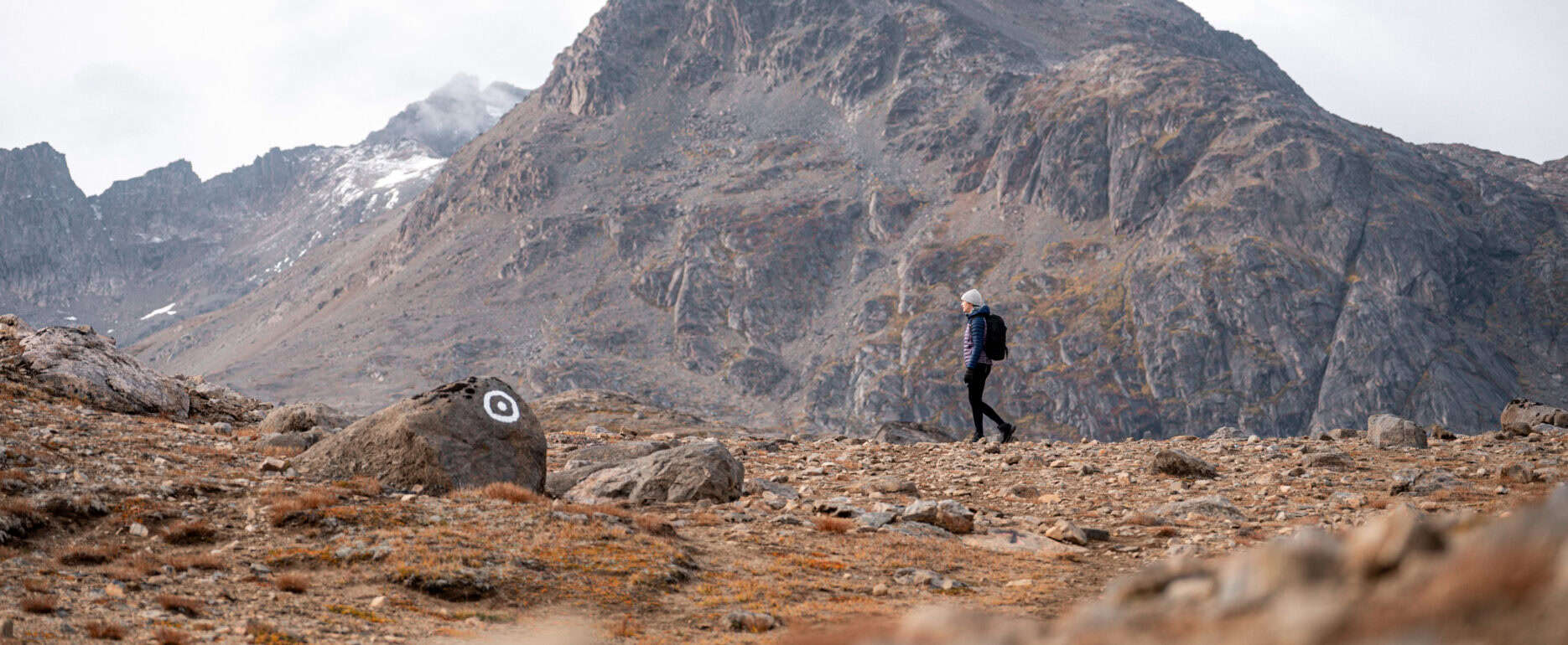Hiking along marked route in the Ammassalik area.
