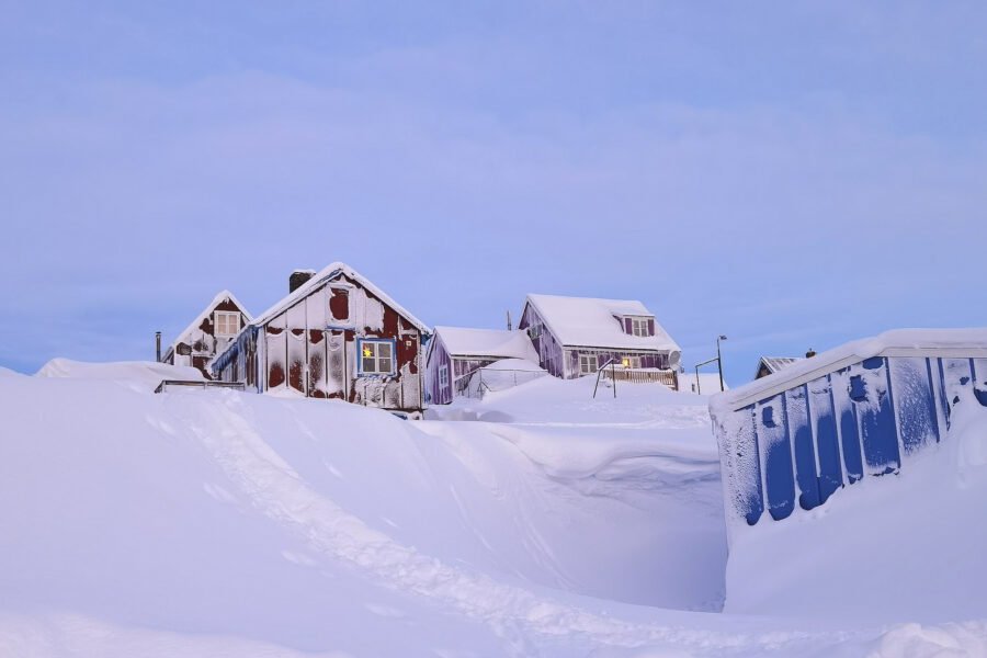 Snowy houses in Ittoqqortoormiit. Photo by Ken Madsen - Visit Greenland