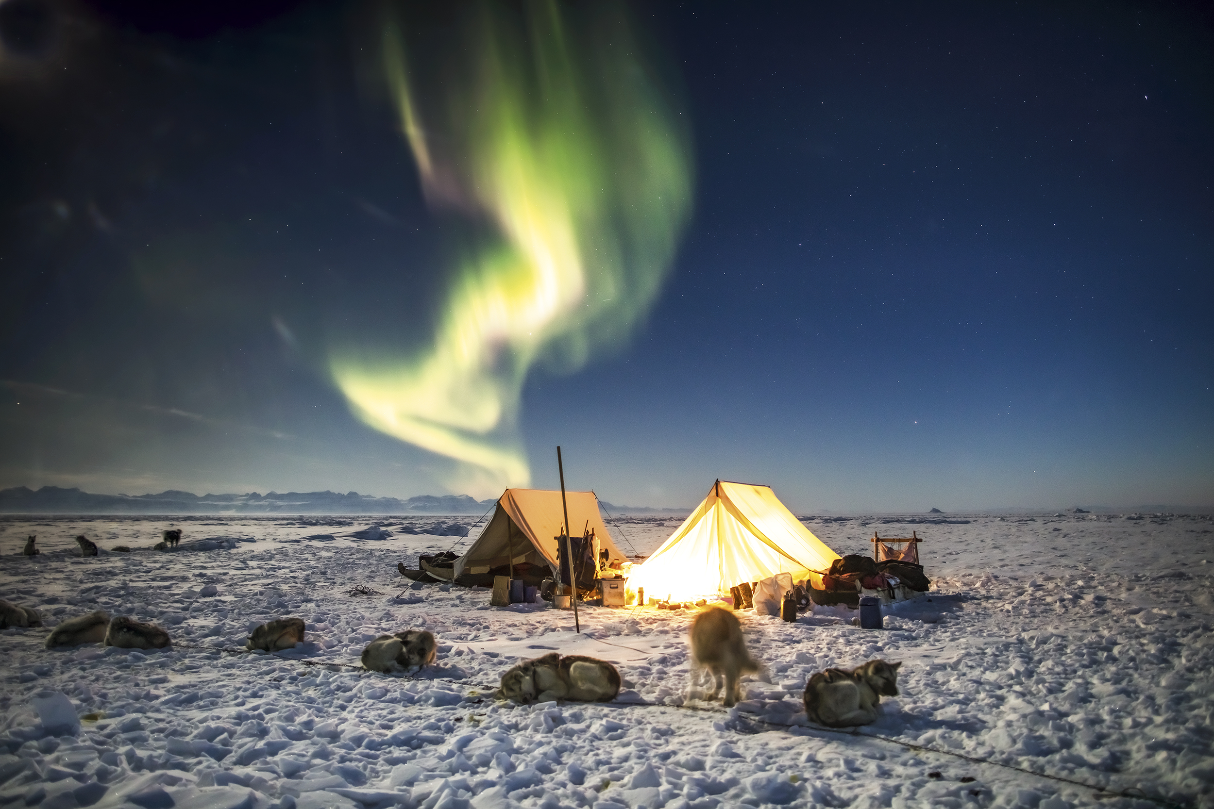 Northern lights over the camp on the ice in Ittoqqortoormiit. Photo by Carsten Egevang - Visit East Greenland