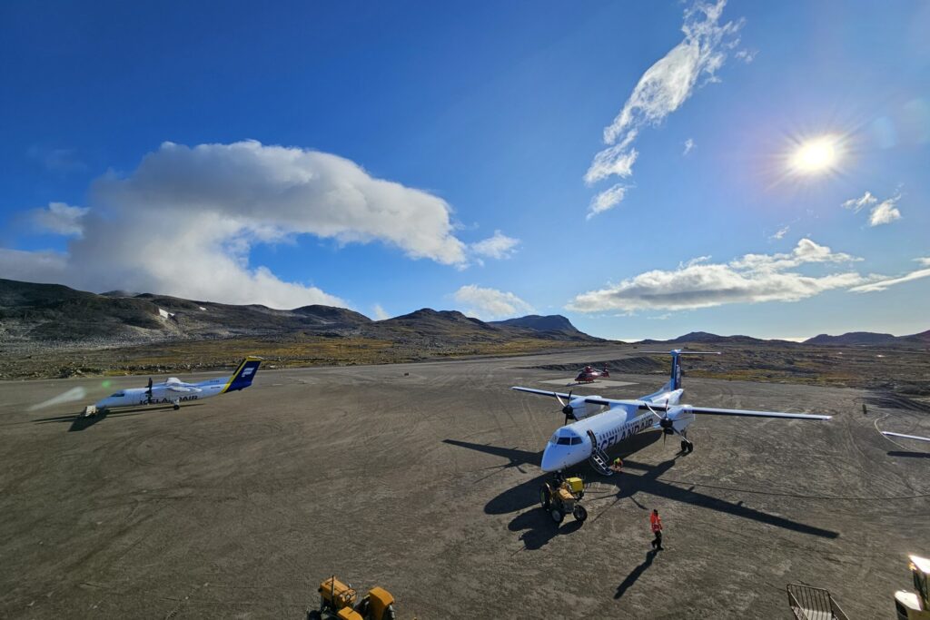 View from the airport tower in Kulusuk with two Icelandair aircrafts refueling before departure.