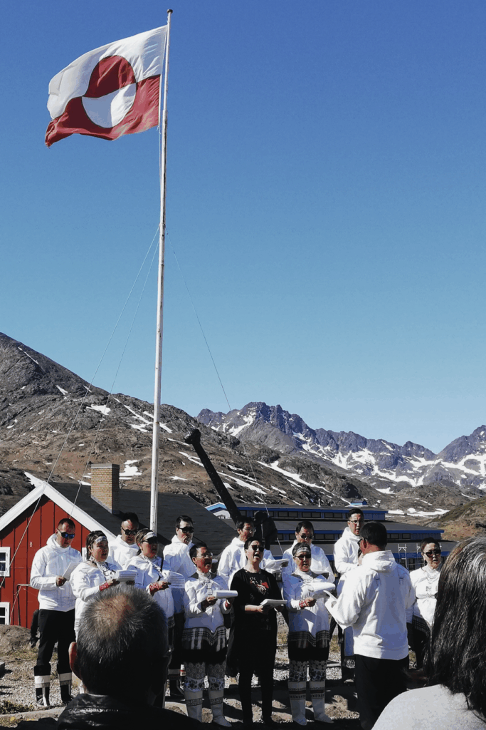 The church choir performing outside the church in Tasiilaq on National Day.